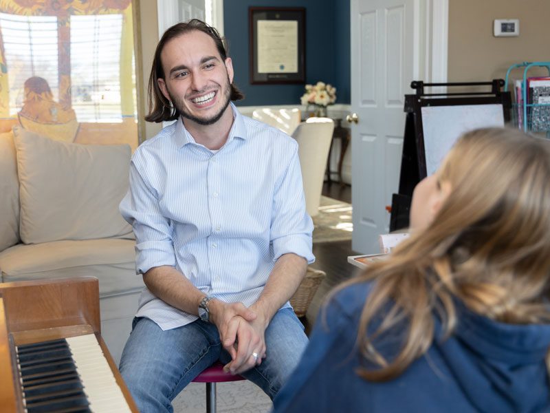 Danton adding some notes to a music sheet during a private music lesson near West Chester, PA.